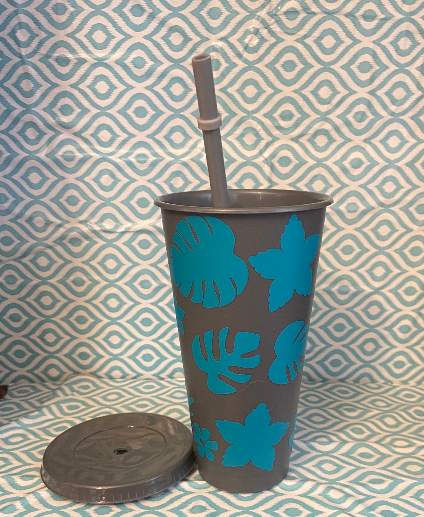Teal flowers and leaves cold cup gray