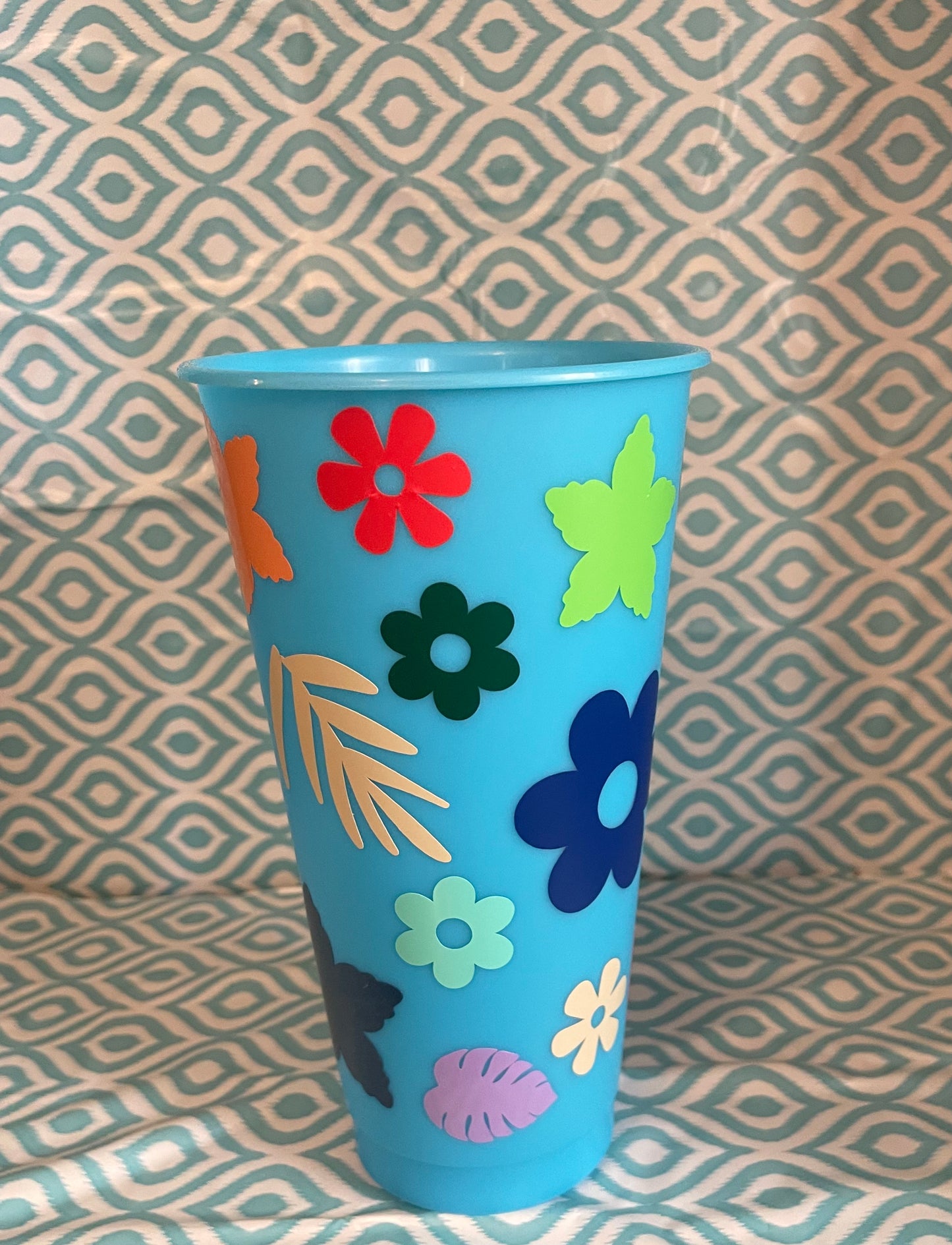 Flowers and leaves light blue cold cup