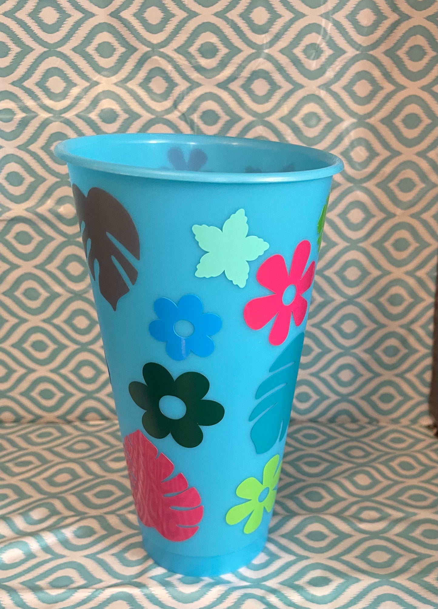 Flowers and leaves light blue cold cup