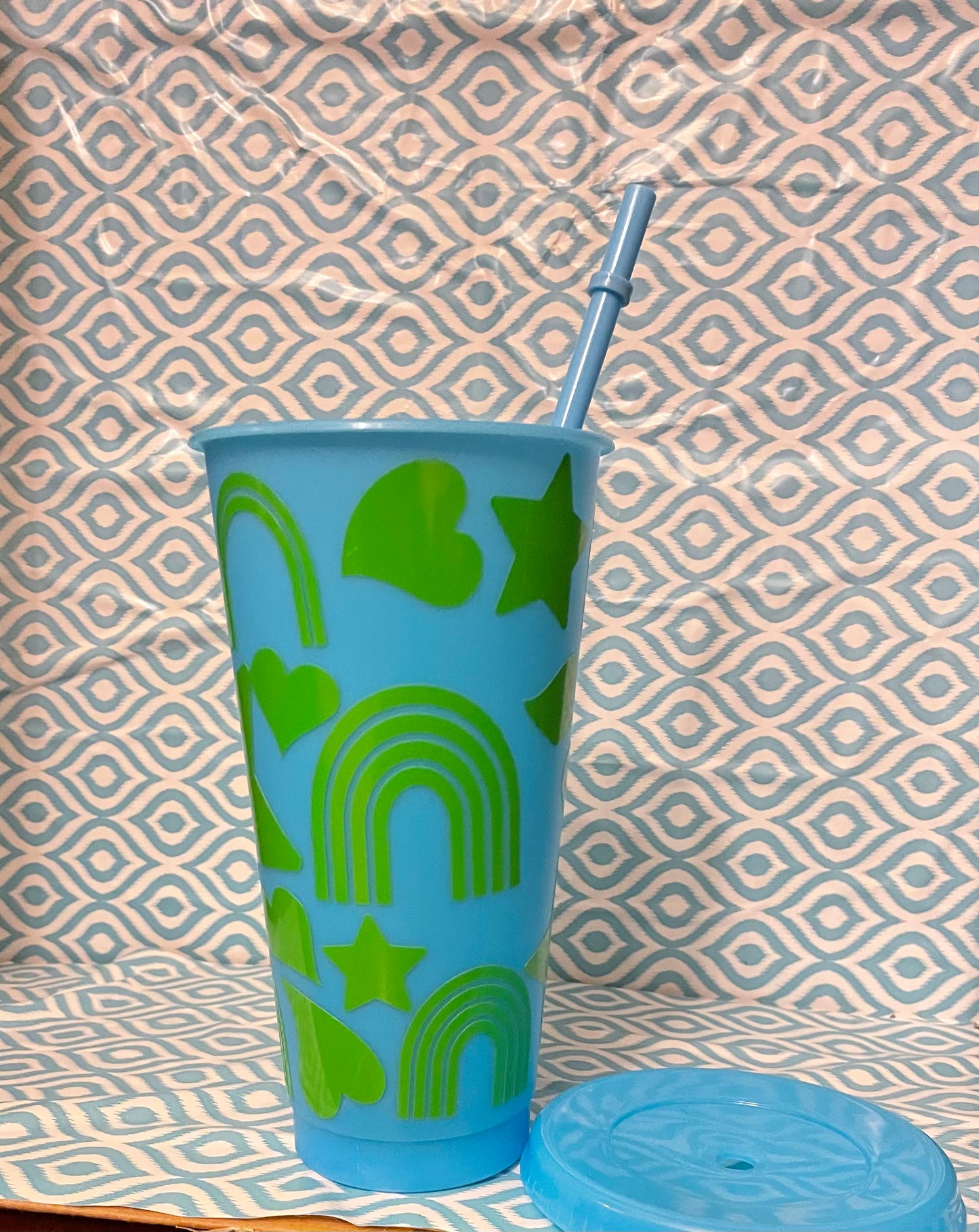 Green shapes cold cup blue