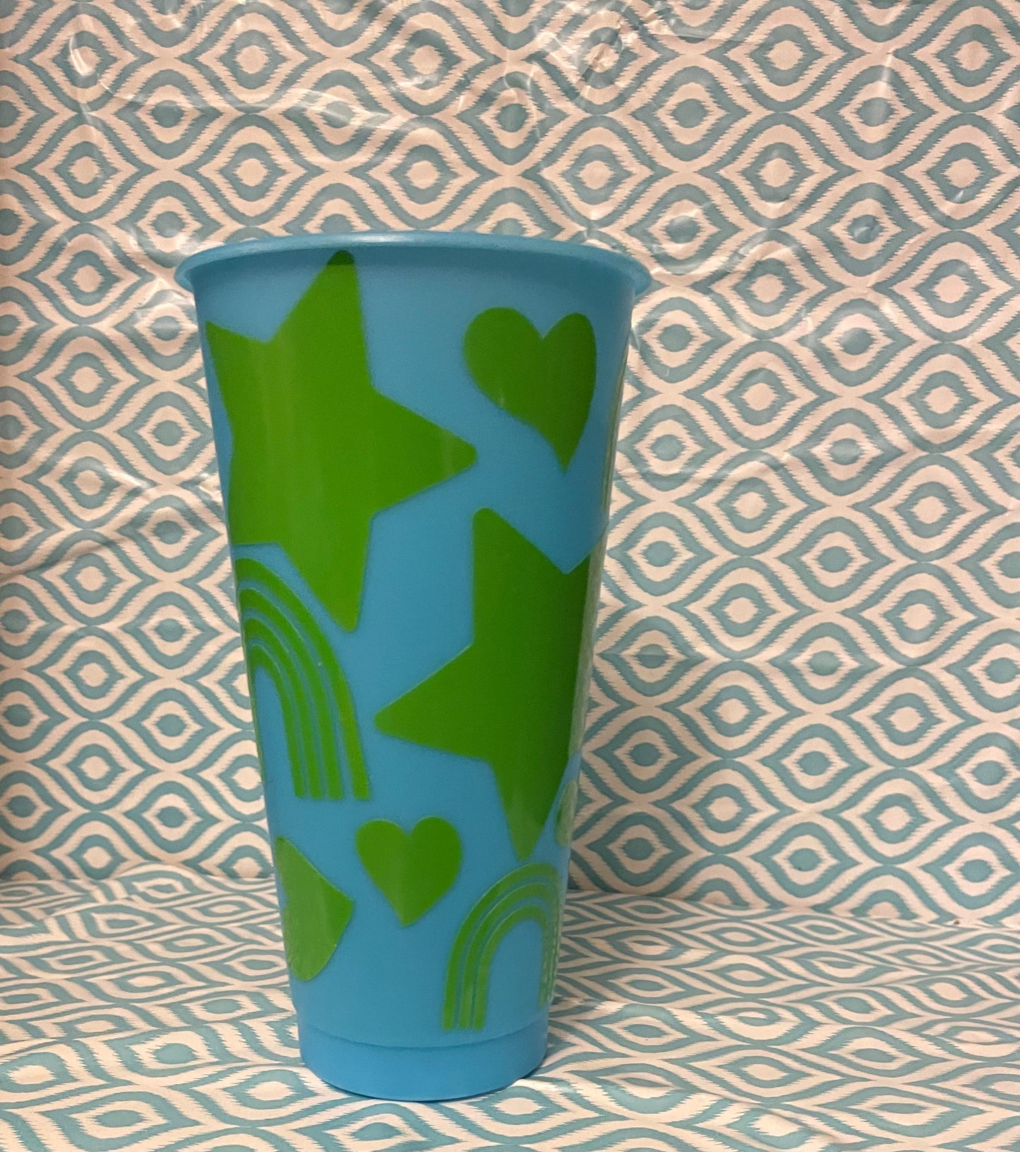 Green shapes cold cup blue