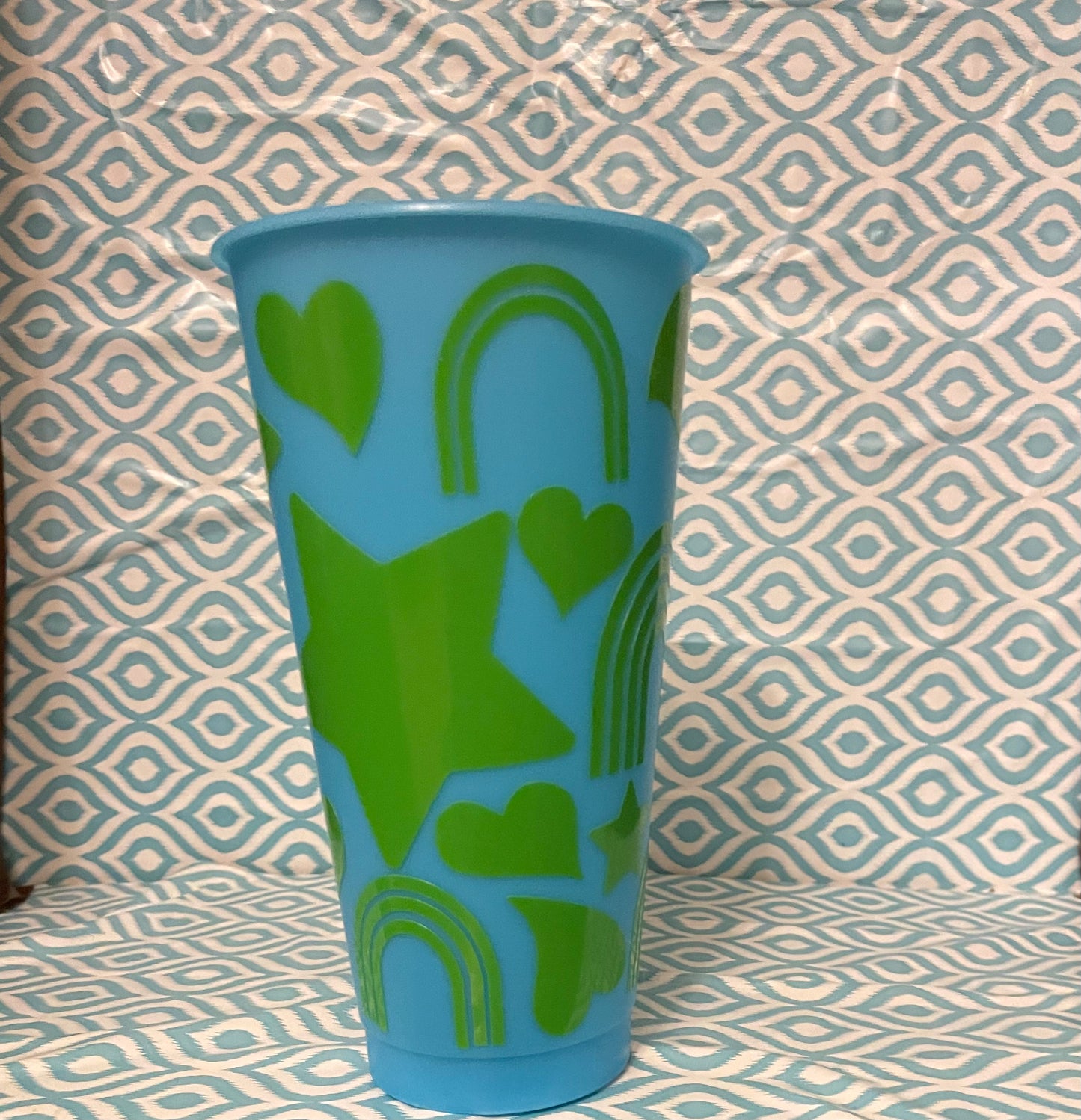 Green shapes cold cup blue