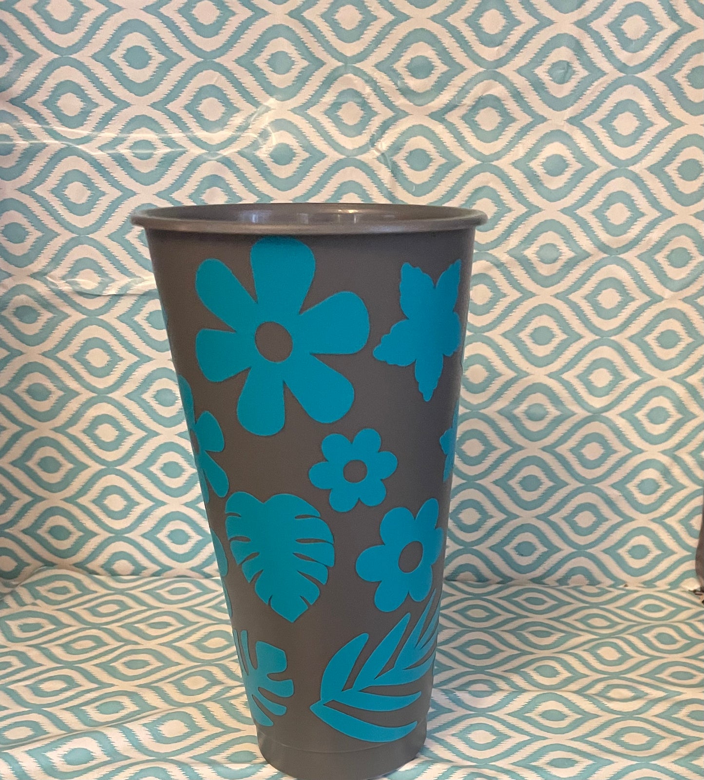 Teal flowers and leaves cold cup gray